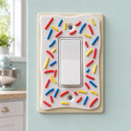 Front close-up of the SprinkleCrust wall plate fitted around a Decora rocker switch