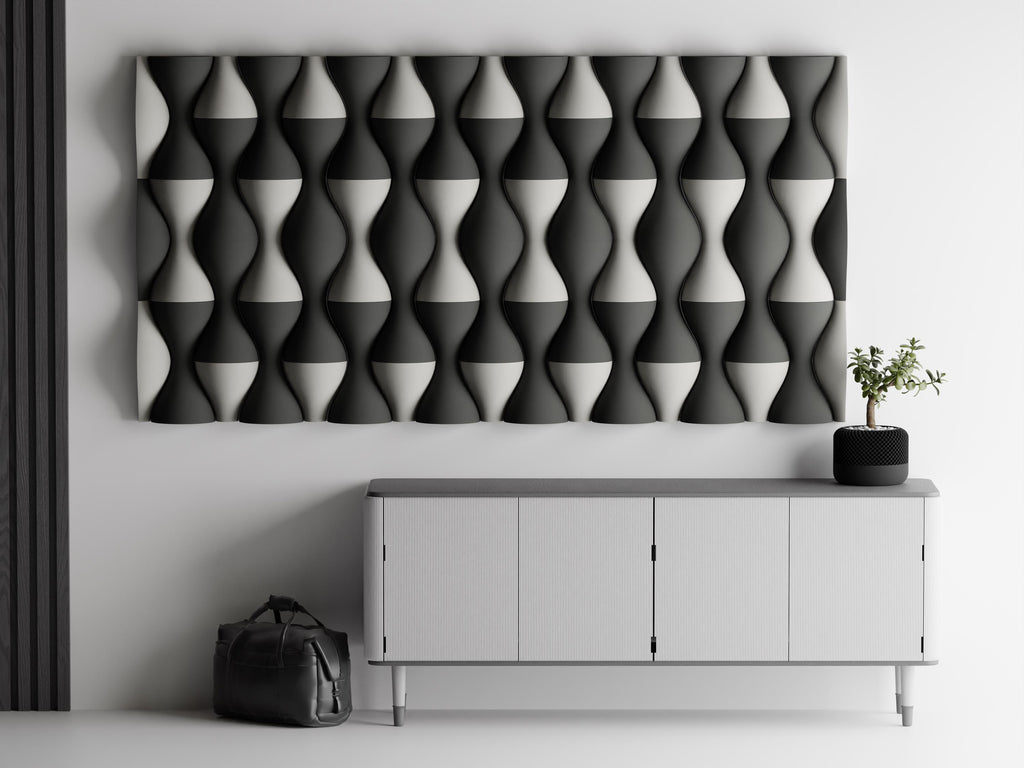 Close-up charcoal and ivory HaloWeave tile arrangement mounted above a modern console