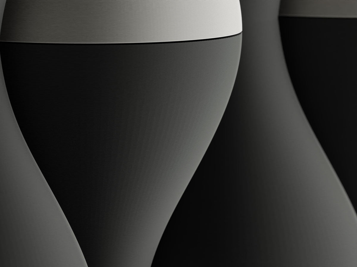 Macro close-up of the charcoal and ivory HaloWeave rounded relief surface