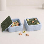 PuffGrid Travel Tic Tac Toe Game, Push Button Storage Box, Padded Look Coffee Table Game, 6 Matte Colorways, shown in the main close-up listing view with its overall design visible.