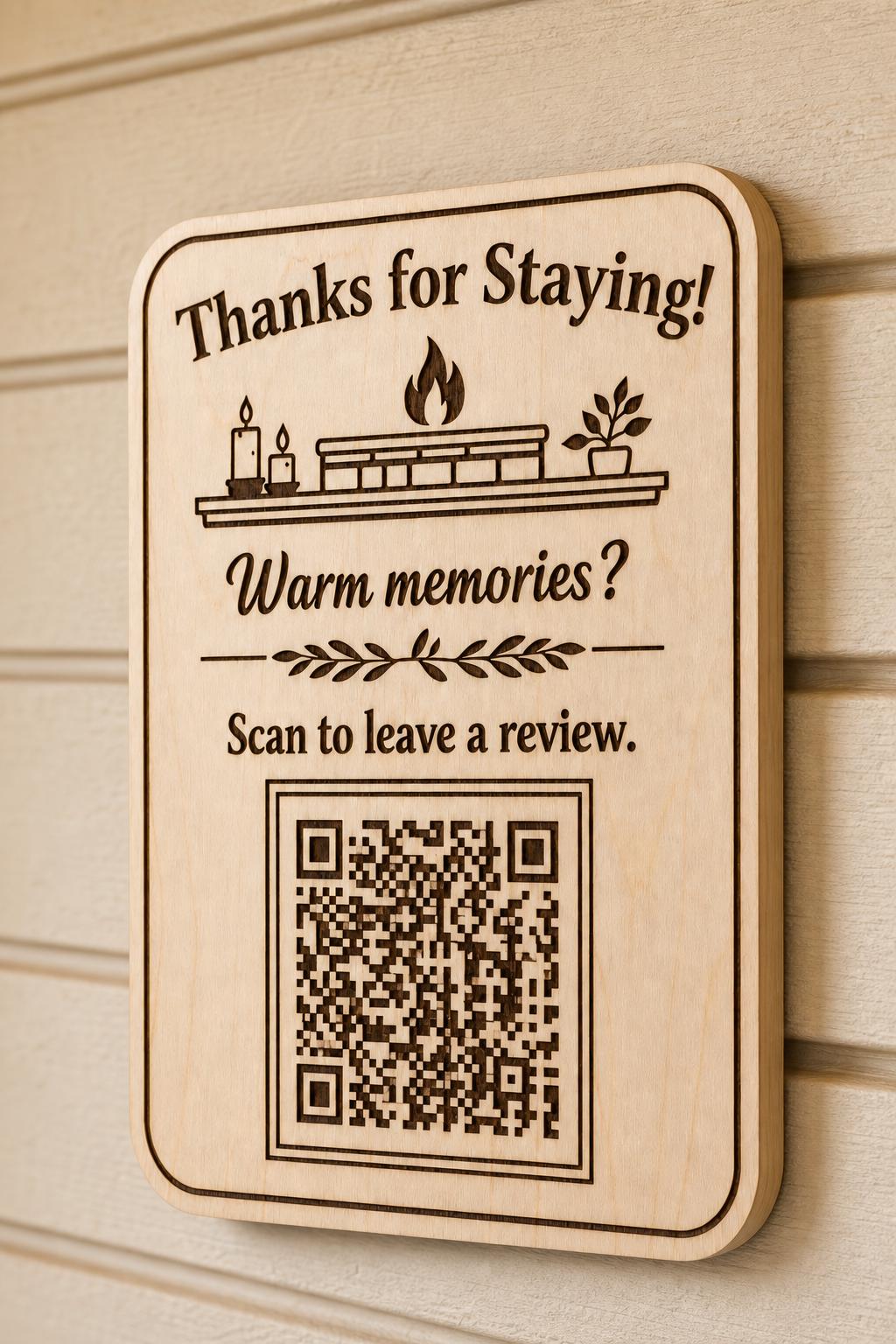 Fireside Keepsake engraved birch review sign mounted on a warm cream wall from a close side angle with a finished sample QR code.