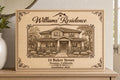 Heirloom Residence engraved birch sign shown close up with a detailed house drawing, Williams family name, and 14 Baker Street.