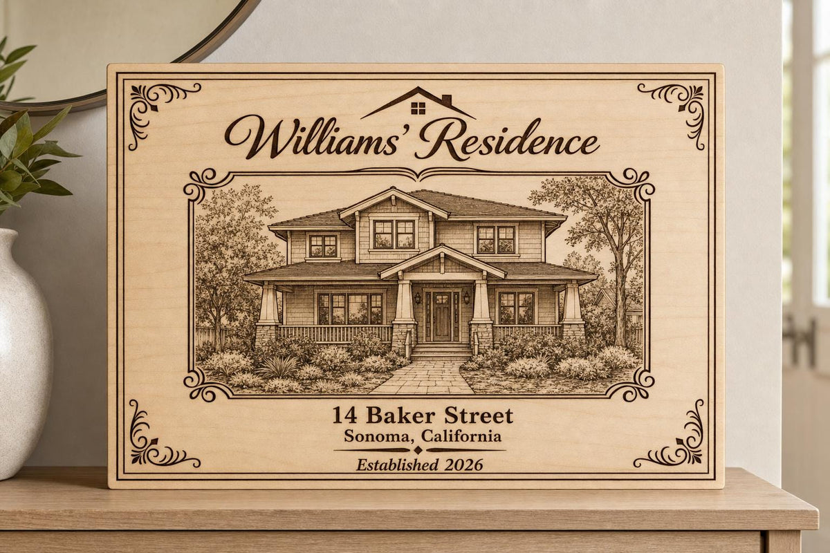 Heirloom Residence engraved birch sign shown close up with a detailed house drawing, Williams family name, and 14 Baker Street.