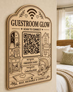 Guestroom Glow WiFi Sign engraved birch sign mounted on a realistic neutral interior wall from a close side angle in natural birch and dark engraving, showing the QR code and guest network details.