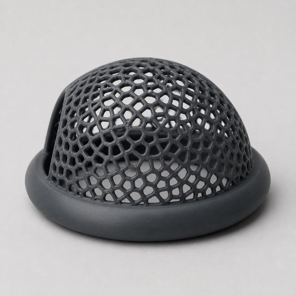 Dark gray floating fish hide on a light gray background, shown from the rear to display the rounded open cellular dome and smooth ring.