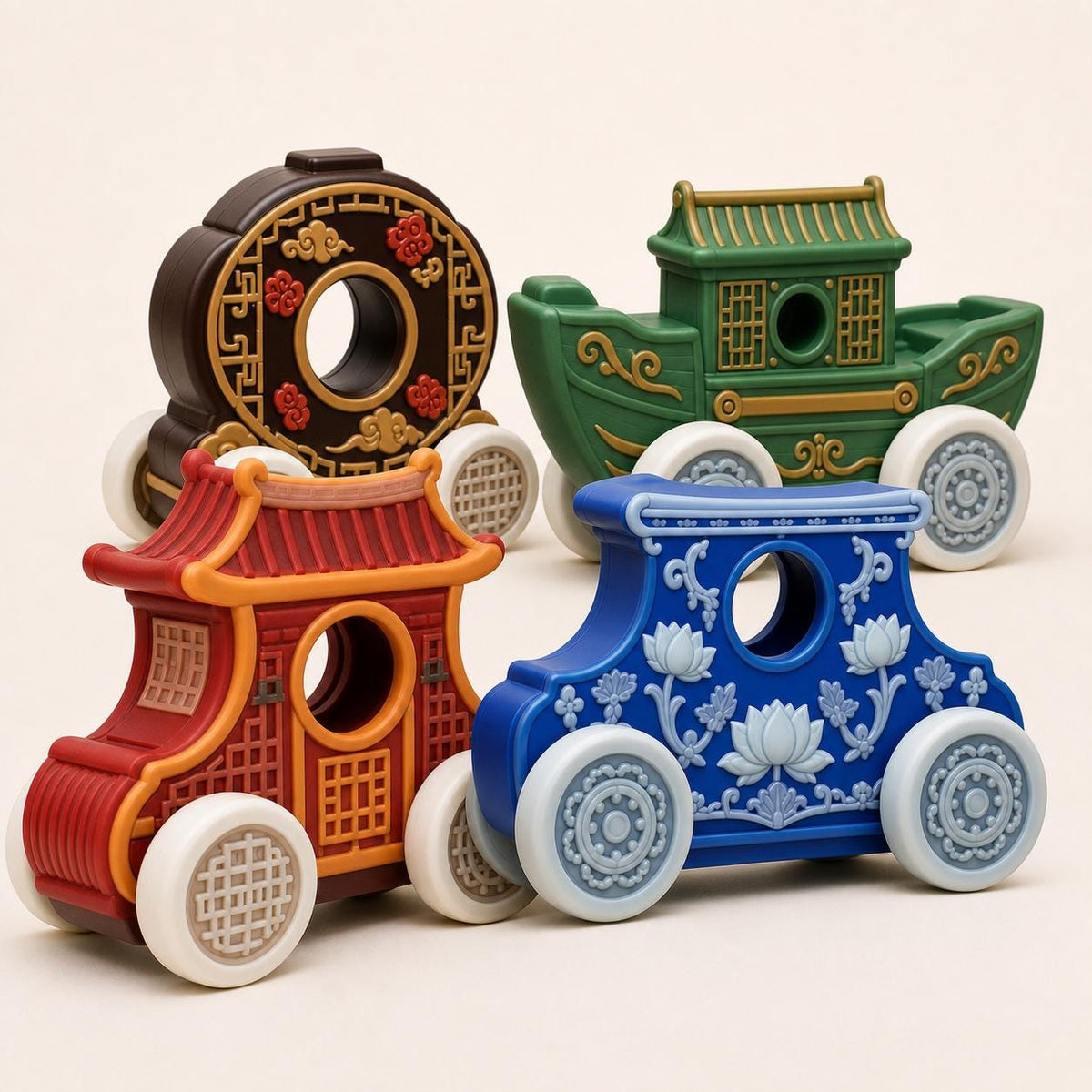 Close studio view of four ornate heritage rolling vehicles in red, blue, chocolate brown, and green on a warm white background