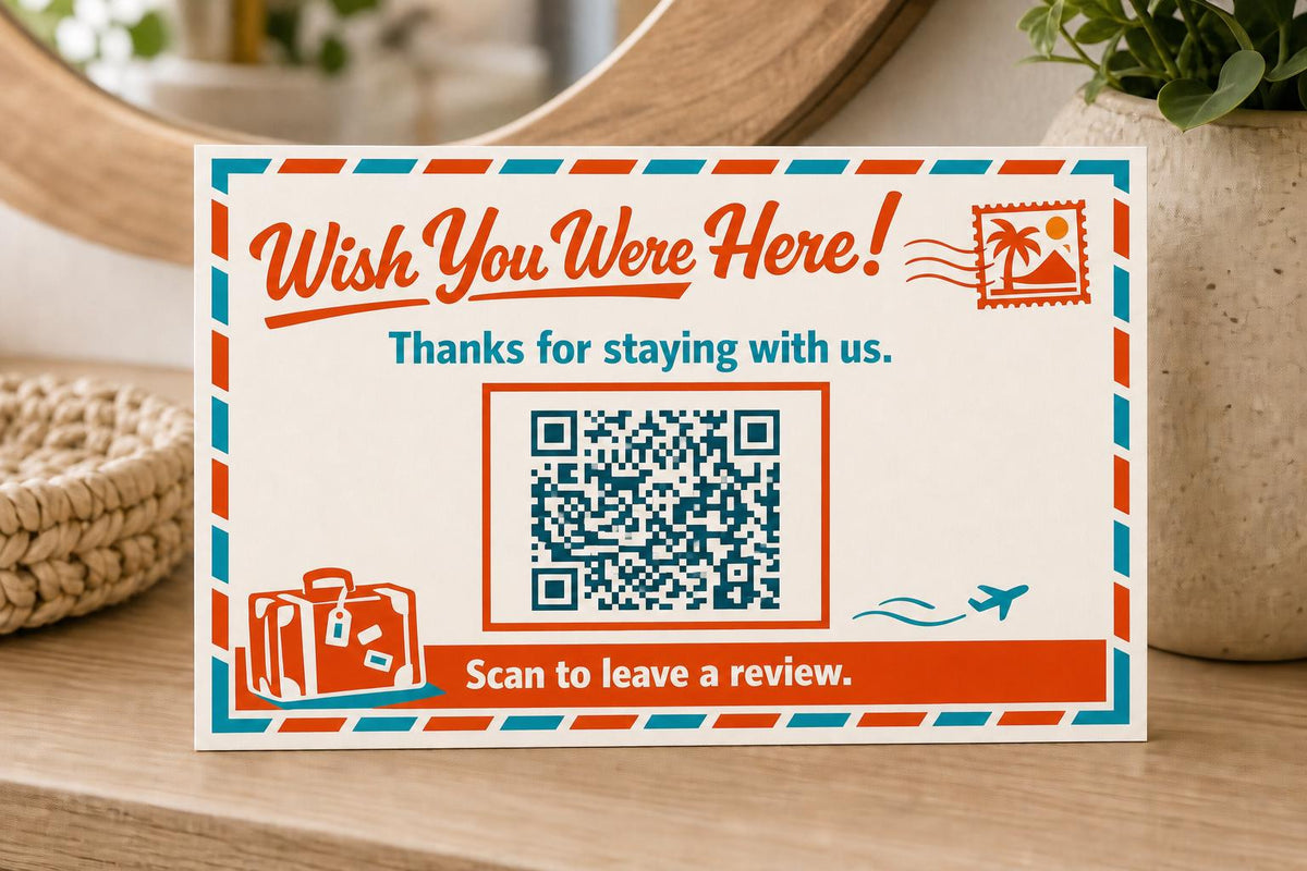 Postcard Farewell multicolor landscape guest review sign upright on a stylish rental console with a finished sample QR code.
