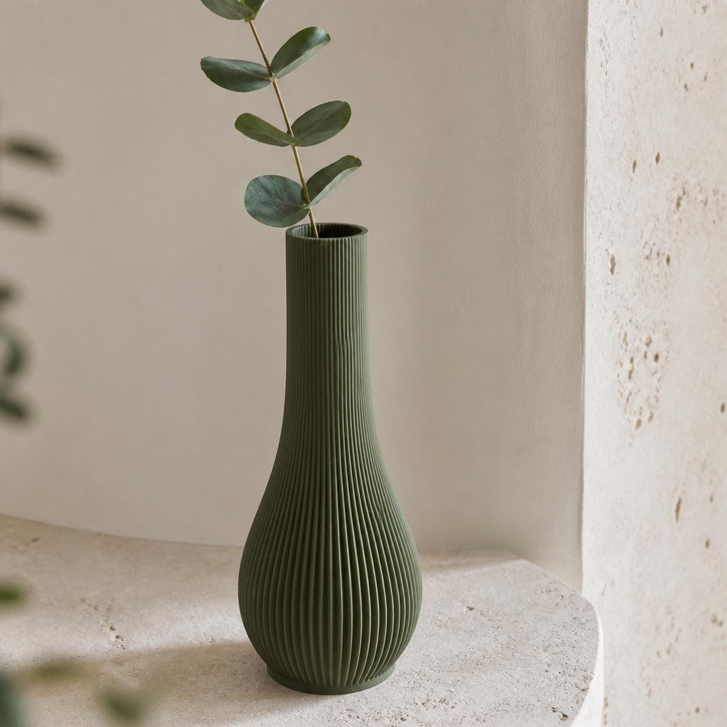 QuietStem Bud Vase, close-up of the Dark Green Serein single stem vase with a eucalyptus sprig
