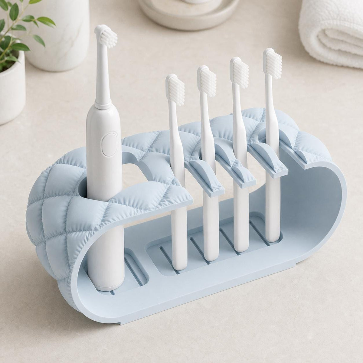 Overhead close-up of an Ice Blue Brushbay Five-Slot Caddy organizer with five toothbrush positions