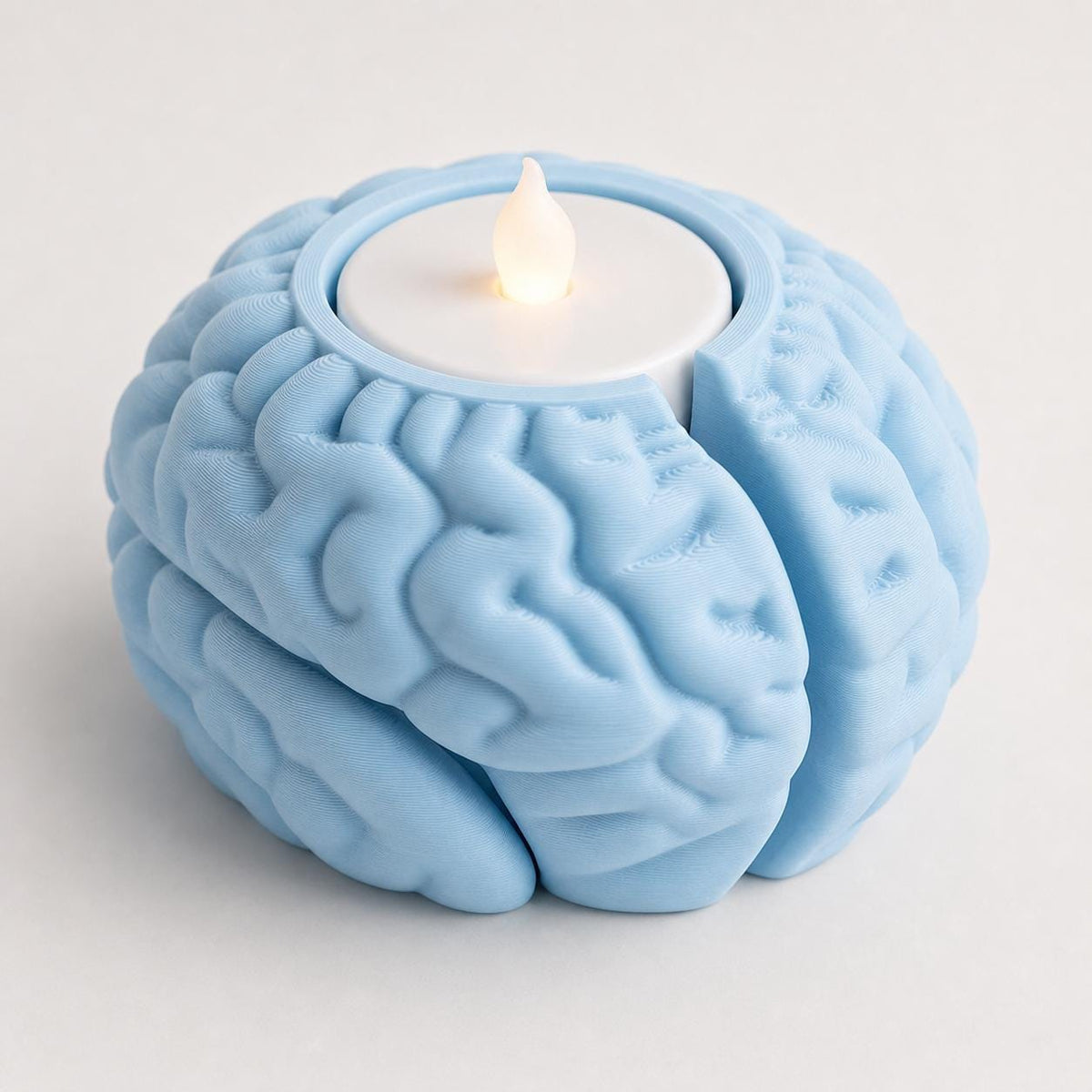 Ice Blue CortexHalo anatomical tealight holder showing the integrated top recess