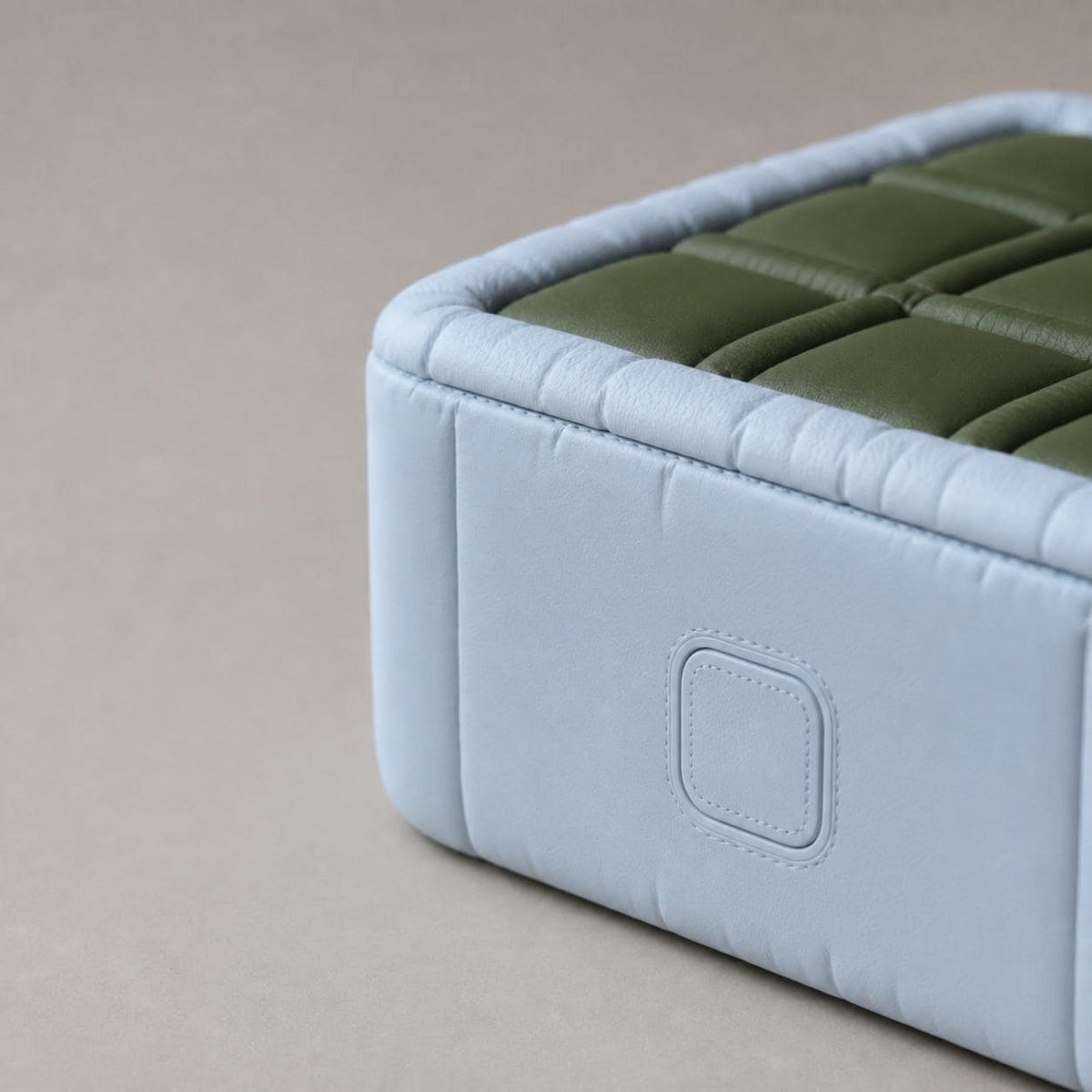 Close-up of the PuffGrid travel game's side release button