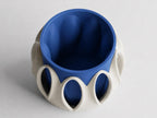 Elevated view into the Arcloom planter in Coastal, showing Ivory White arches and a Marine Blue inner pot on a pale gray background.