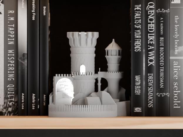 Emberwatch Tower Book Nook in a light neutral color, shown from the front between books on a wooden shelf.