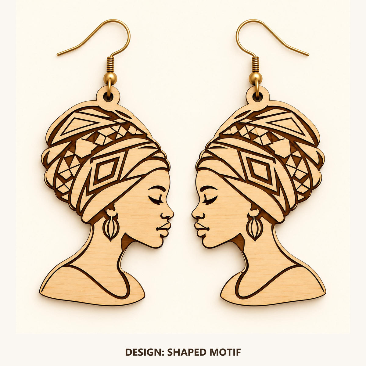 Front view of the Accra Shaped Motif engraved birch earring pair on a light background.