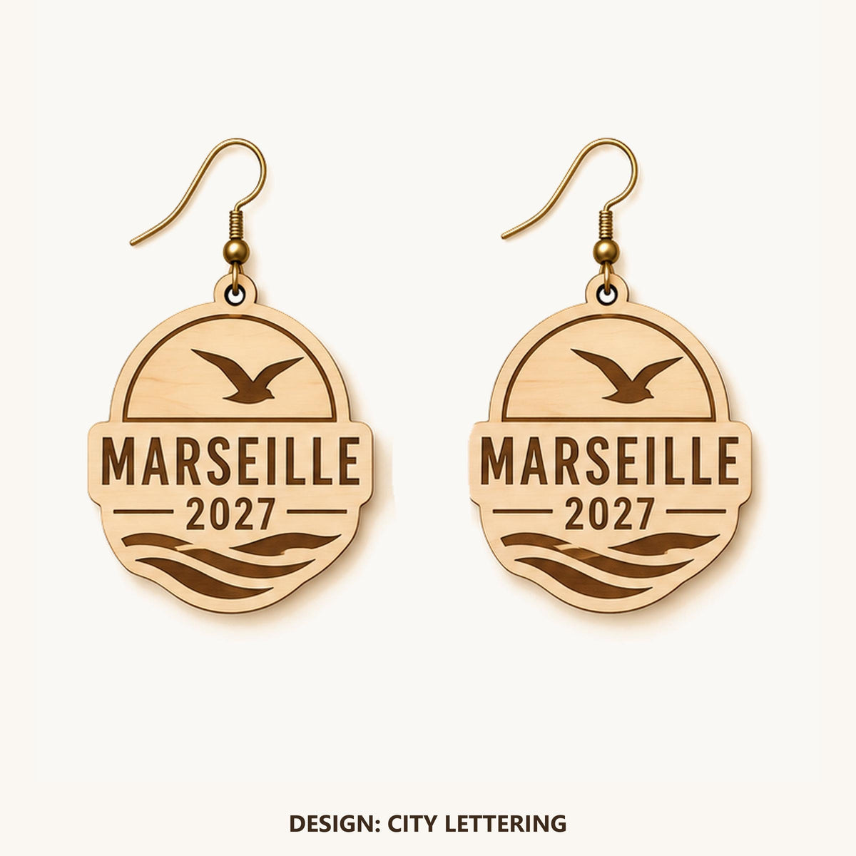 Front view of the Marseille City Lettering engraved birch earring pair on a light background.