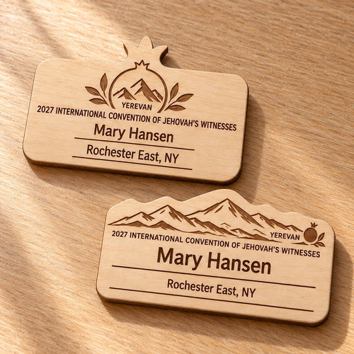 Two Yerevan mini natural-birch engraved badge designs, slot-free and laid separately on a light oak tabletop; each shows sample personalization.