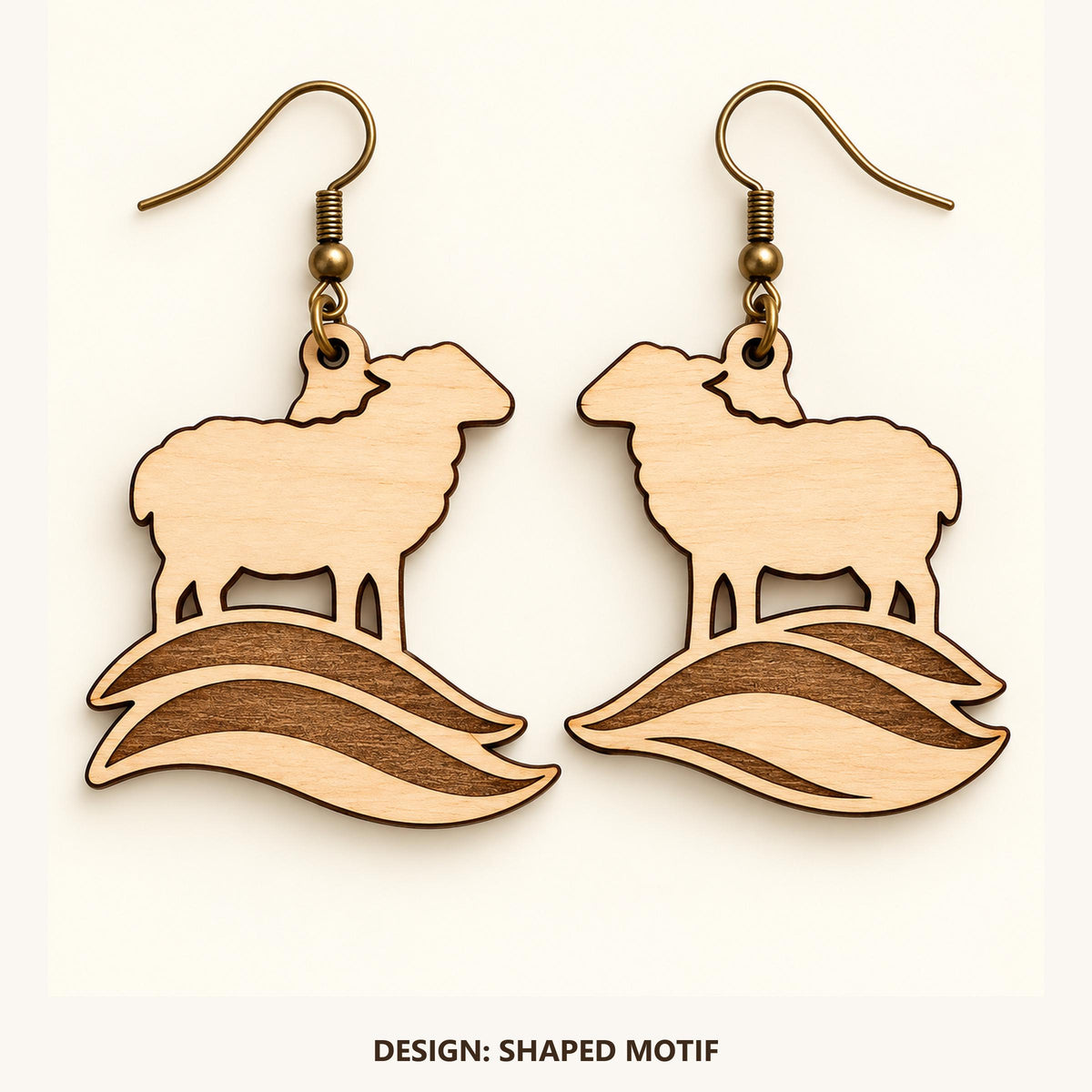 Front view of the Cardiff Shaped Motif engraved birch earring pair on a light background.
