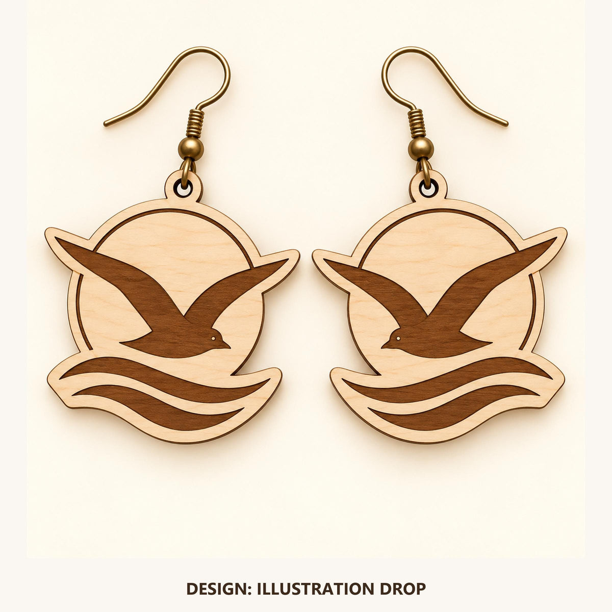 Front view of the Marseille Illustration Drop engraved birch earring pair on a light background.