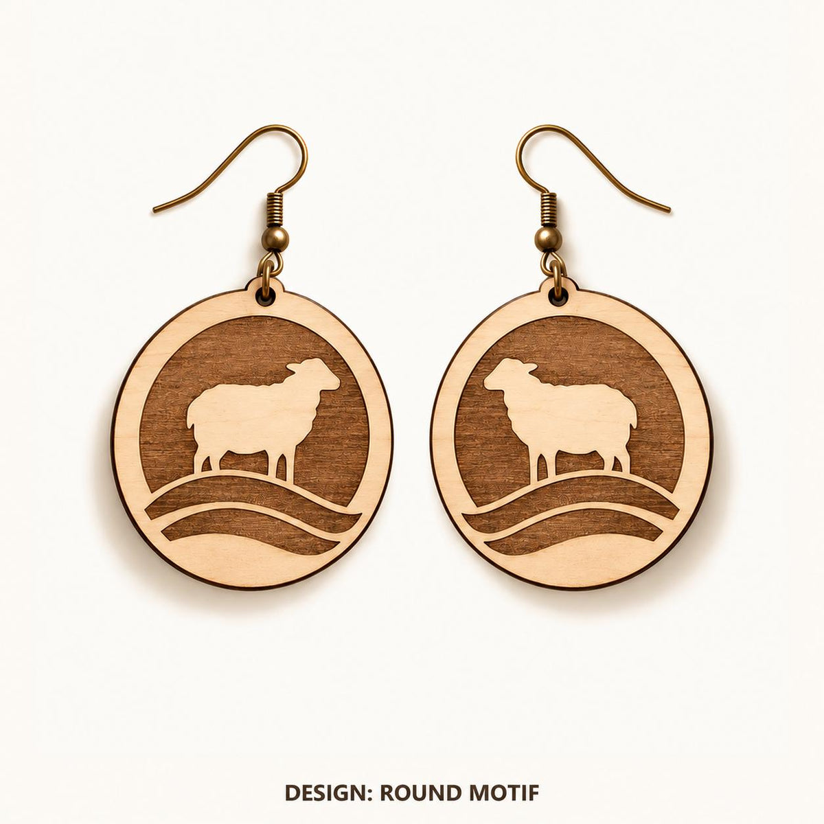 Front view of the Cardiff Round Motif engraved birch earring pair on a light background.