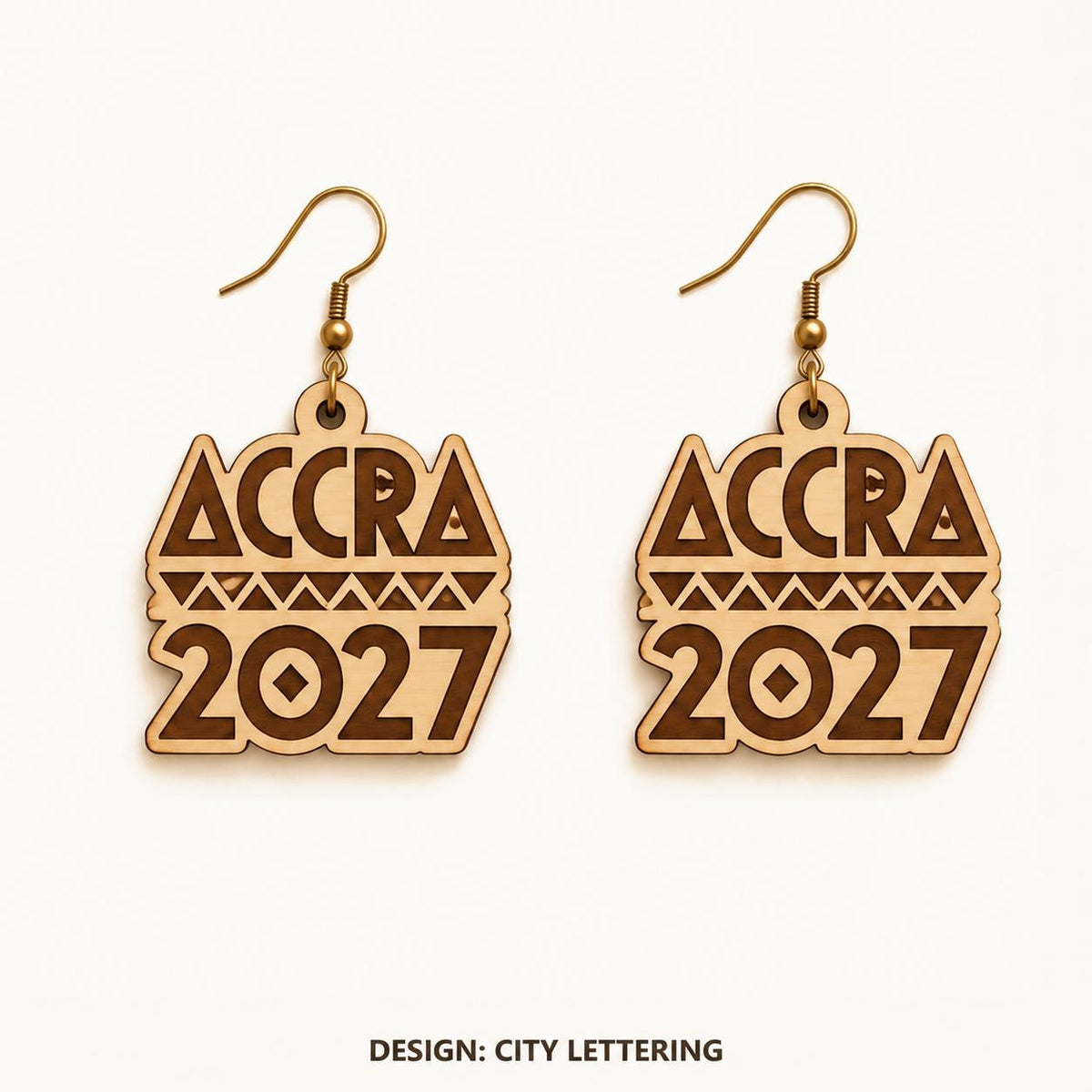 Front view of the Accra City Lettering engraved birch earring pair on a light background.