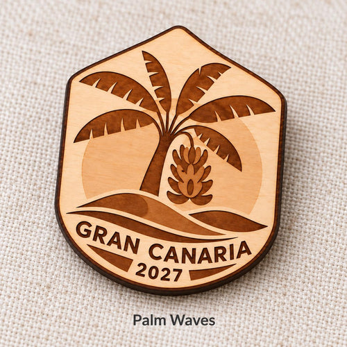Close-up of Gran Canaria Palm Waves engraved birch pin on linen, with design name caption.
